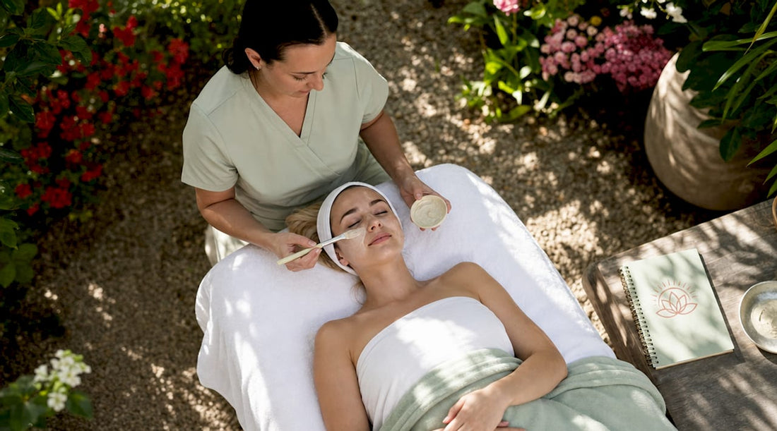 Esthetician applying enzyme facial mask in spa room